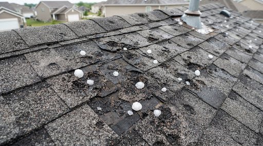 Midtown Dundee roof severe hail damage before restoration